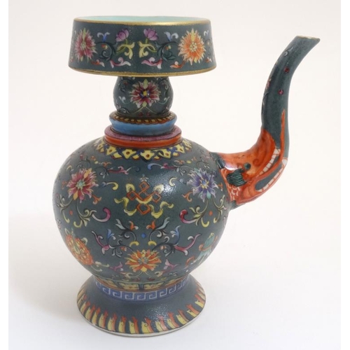 432 - A Chinese lidded wine decanter , having decorative dragon spout , the body decorated in polychrome w... 