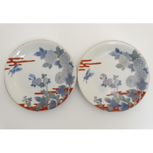 433 - A pair of 19thC Japanese Arita Shiroiwa plates , decorated with flowers and butterflies in blue and ... 