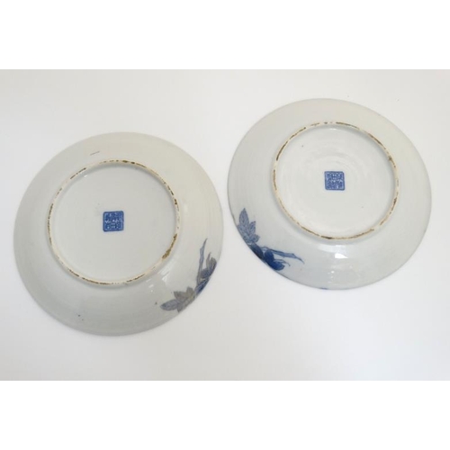 433 - A pair of 19thC Japanese Arita Shiroiwa plates , decorated with flowers and butterflies in blue and ... 