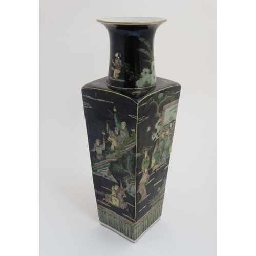 434 - A Chinese famille noir vase decorated with figures , horses and military buildings, bears blue Chine... 