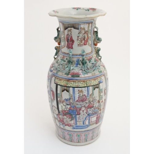 436 - A large Chinese Canton famille rose vase of baluster form, having opposing figural panels decorated ... 