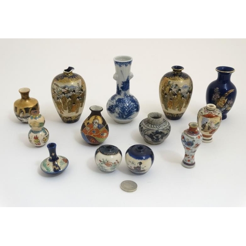 438 - A collection of 13 Chinese and Japanese small and miniature vases, to include blue and white, Satsum... 