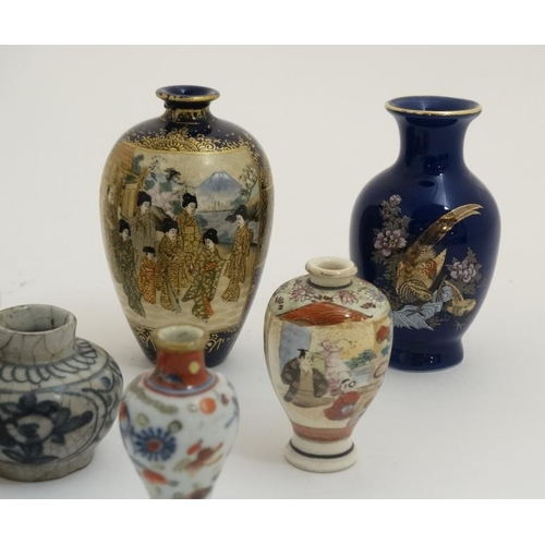 438 - A collection of 13 Chinese and Japanese small and miniature vases, to include blue and white, Satsum... 