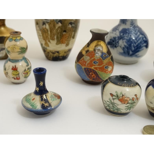 438 - A collection of 13 Chinese and Japanese small and miniature vases, to include blue and white, Satsum... 