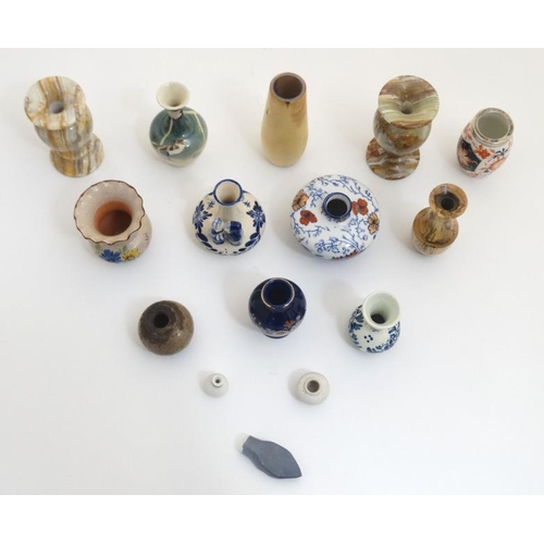 439 - A collection of 14 small and miniature vases to include blue and white delft , Oriental, wooden and ... 