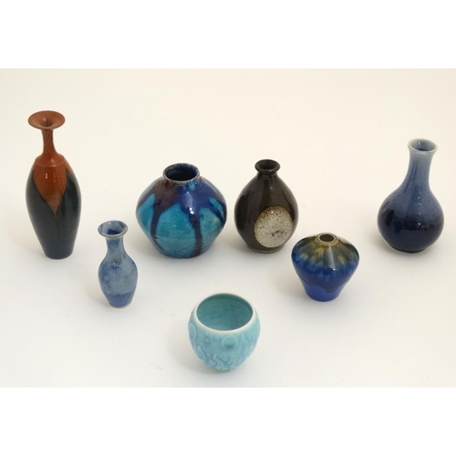 441 - A collection of 7 small Studio Pottery vases to include a number of high fired examples. The tallest... 