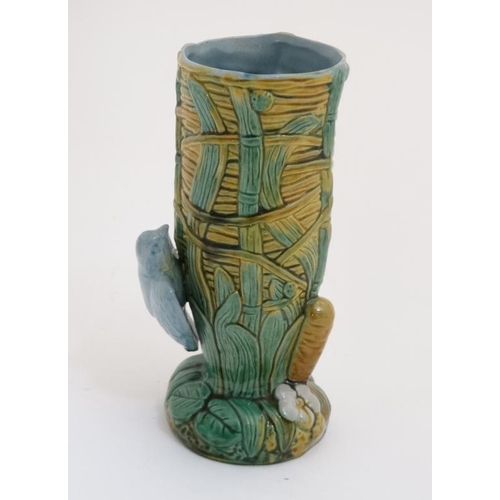 447 - A 21stC George Jones style Majolica 'Bird on Nest' vase having blue bird to side and bullrush decora... 