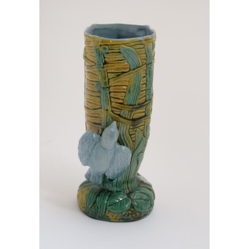 447 - A 21stC George Jones style Majolica 'Bird on Nest' vase having blue bird to side and bullrush decora... 