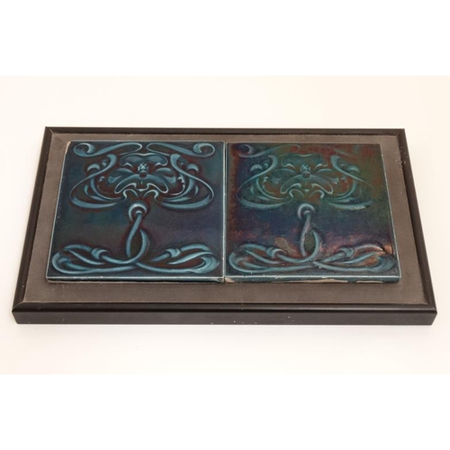 449 - A pair of framed Art Nouveau majolica style tiles in dark blue decorated with stylised flowers. Each... 