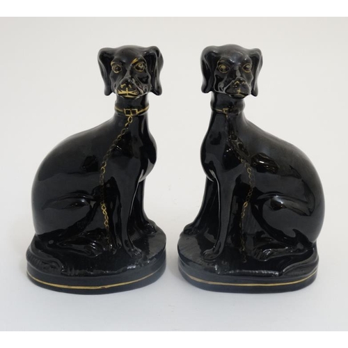 456 - A pair of Jackfield Black Victorian Staffordshire pottery seated greyhounds , having gilt coloured c... 