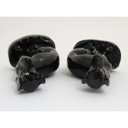 456 - A pair of Jackfield Black Victorian Staffordshire pottery seated greyhounds , having gilt coloured c... 