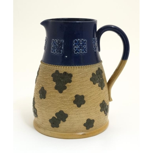 465 - A large Royal Doulton Lambeth Jug having cobalt blue banded top section with stylised leaves and sty... 