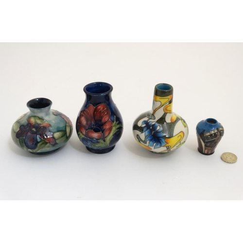 471 - Two Moorcroft vases , to include an 'orchid vase' on a pale blue ground and a '' poppy '' vase and a... 