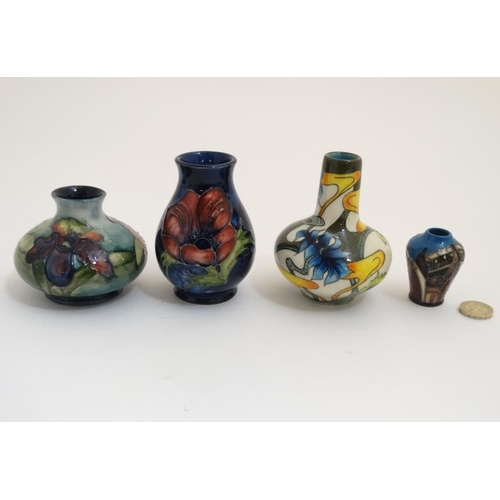 471 - Two Moorcroft vases , to include an 'orchid vase' on a pale blue ground and a '' poppy '' vase and a... 