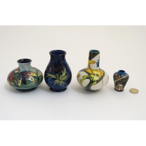 471 - Two Moorcroft vases , to include an 'orchid vase' on a pale blue ground and a '' poppy '' vase and a... 