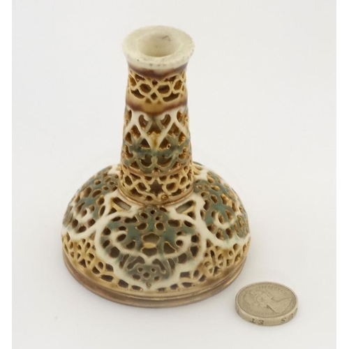 476 - A c1900 Zsolnay miniature reticulated bottle vase, decorated in green and gilt colours of a cream gr... 