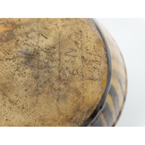 477 - An early / mid 20th slipware pottery banded ale jug , bears indistinct pencil marks to base. 6 1/2''... 