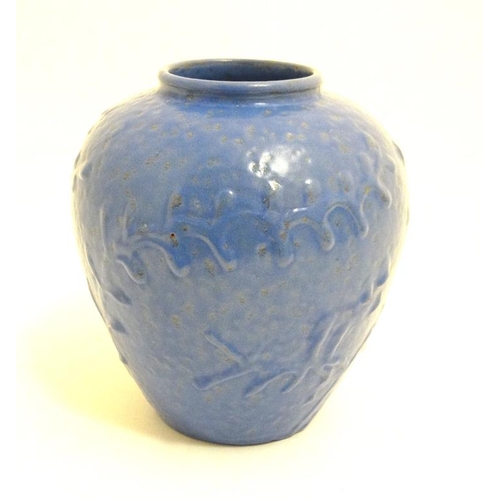 488 - Scandinavian Pottery: A 1940s/50s Nittsjo pottery vase , having relief foliate detail on a blue grou... 