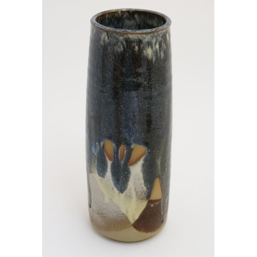 492 - A Canterbury Cotton Studio Pottery cylinder vase, decorated in shades of blue and brown , bears sign... 