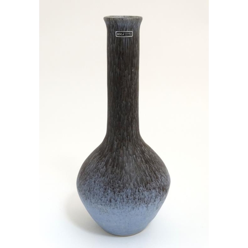 493 - Scandinavian Pottery: A Beka Keramik, Sweden bottle vase by Birger Astrom, decorated in mottled blue... 