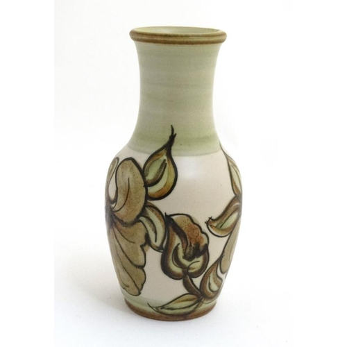 494 - A Langley pottery vase with green floral decoration , bears factory stamp to base. 10'' high.