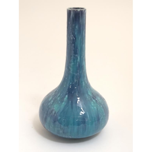 496 - A Ruskin pottery style high fired bottle neck vase in blue and green , 8 3/4'' high.