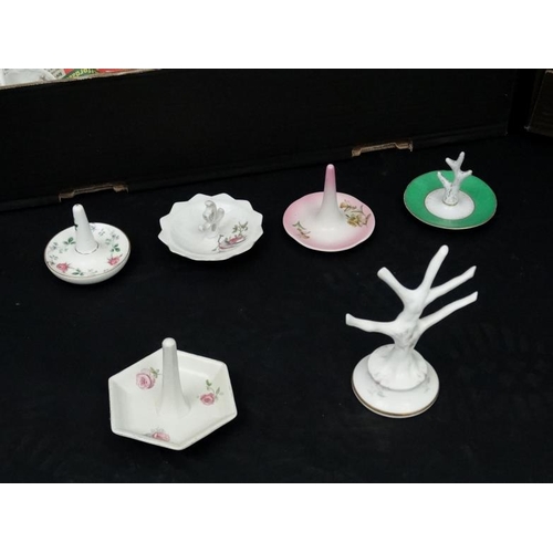 502 - A large collection of approximately 100 19th and 20thC ring trees , to include examples by Noritake,... 