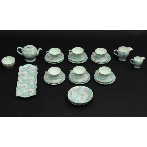 503 - A collection of Shelley '' Melody '' pattern tea wares, number 13453,  to include teapot, sugar bowl... 