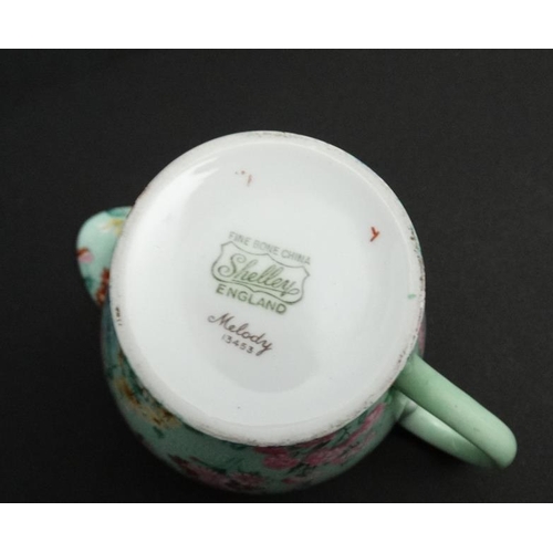 503 - A collection of Shelley '' Melody '' pattern tea wares, number 13453,  to include teapot, sugar bowl... 