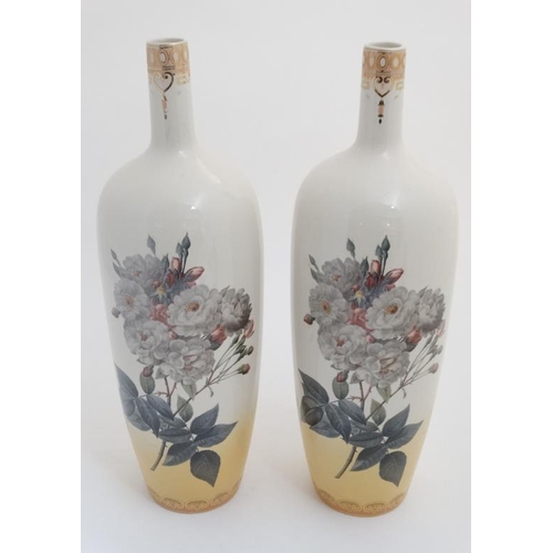 508A - A pair of large ceramic vases, decorated with cabbage roses on a white ground with Art Nouveau style... 