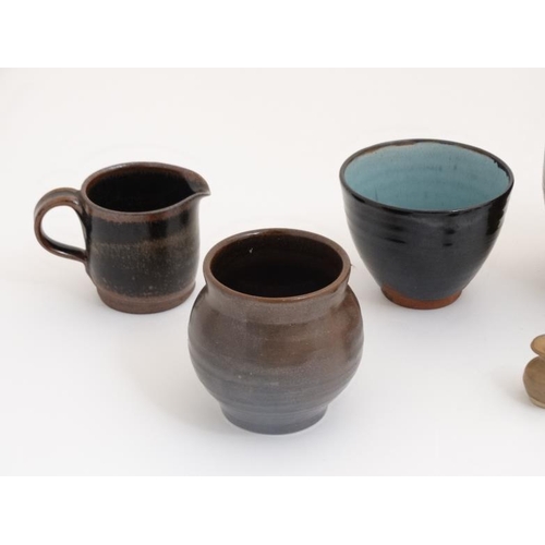 509 - A collection of 10 pieces of  1970s studio pottery such as vases and mugs to include examples by Mcl... 