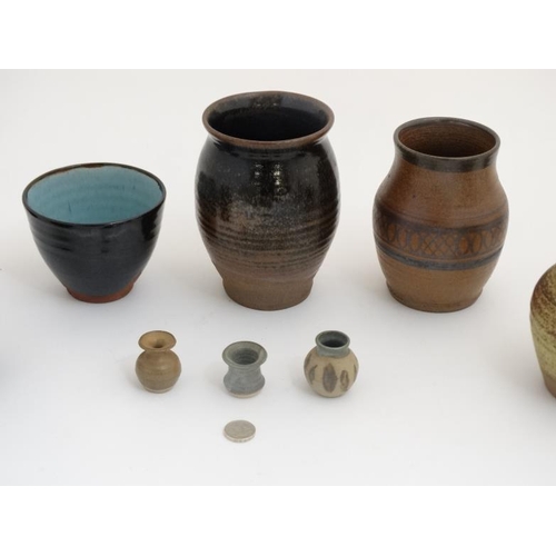 509 - A collection of 10 pieces of  1970s studio pottery such as vases and mugs to include examples by Mcl... 