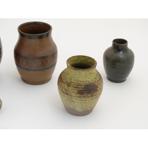 509 - A collection of 10 pieces of  1970s studio pottery such as vases and mugs to include examples by Mcl... 