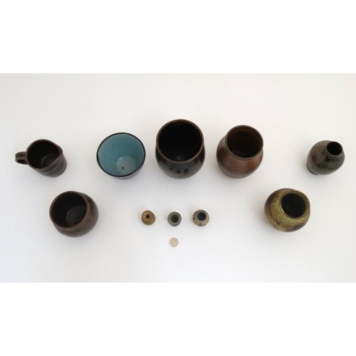 509 - A collection of 10 pieces of  1970s studio pottery such as vases and mugs to include examples by Mcl... 