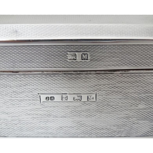 512 - An Art Deco silver table top cigarette box with engine turned decoration. Hallmarked Birmingham 1936... 