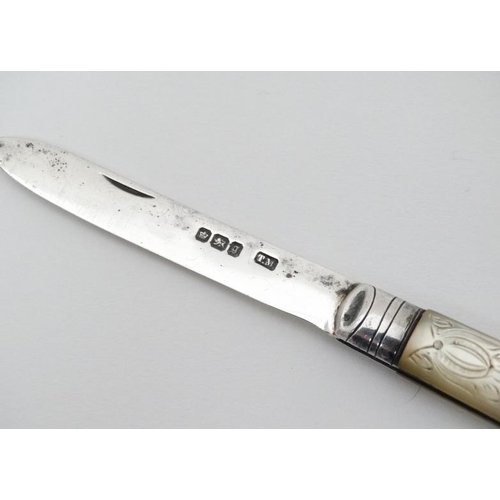 514 - A silver folding fruit knife with mother of pearl handle having engraved decoration Hallmarked Sheff... 