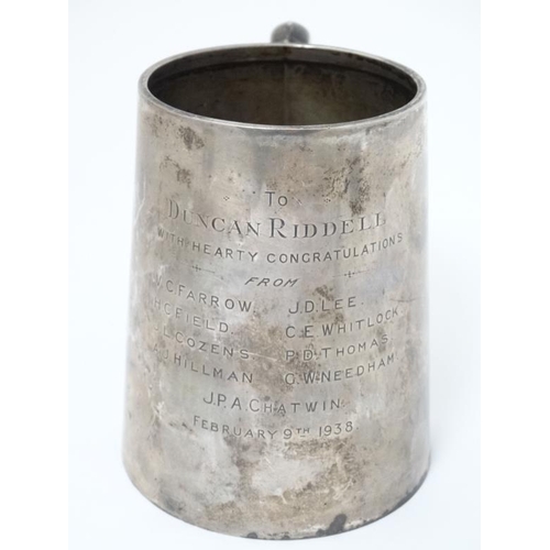 515 - A silver tankard with loop handle Hallmarked  Birmingham 1936 maker Charles S Green & Co. Ltd. 4 1/2... 