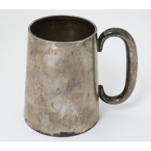 515 - A silver tankard with loop handle Hallmarked  Birmingham 1936 maker Charles S Green & Co. Ltd. 4 1/2... 