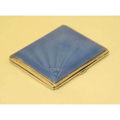 520 - An Art Deco silver cigarette case with engine turned and blue guilloché enamel decoration. Hallmarke... 