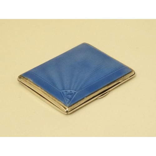 520 - An Art Deco silver cigarette case with engine turned and blue guilloché enamel decoration. Hallmarke... 