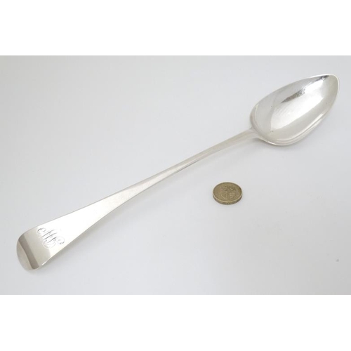 521 - A Geo III silver Old English pattern basting spoon. Hallmarked London 1805 maker Thomas Streetin. 12... 