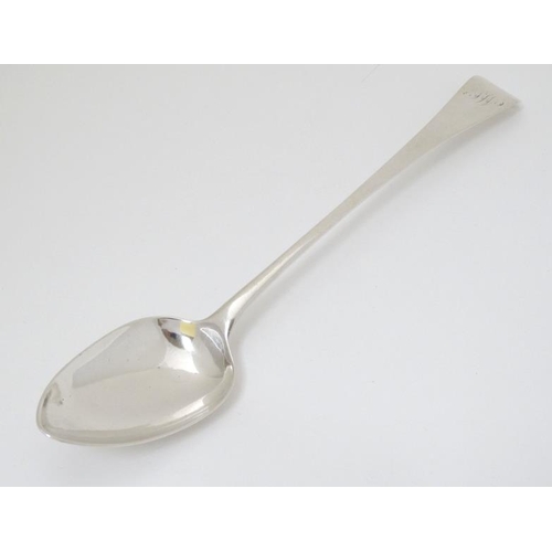 521 - A Geo III silver Old English pattern basting spoon. Hallmarked London 1805 maker Thomas Streetin. 12... 