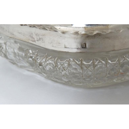 531 - A cut glass dressing table pot with silver lid hallmarked Birmingham 1903. 4 1/2'' wide