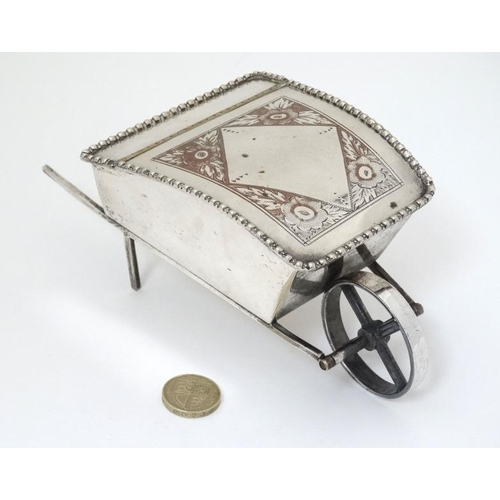 535 - A novelty silver plate sugar box formed as a wheelbarrow with hinged lid 7 1/2'' long