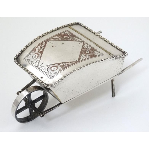 535 - A novelty silver plate sugar box formed as a wheelbarrow with hinged lid 7 1/2'' long