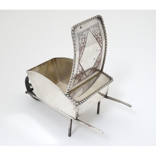 535 - A novelty silver plate sugar box formed as a wheelbarrow with hinged lid 7 1/2'' long