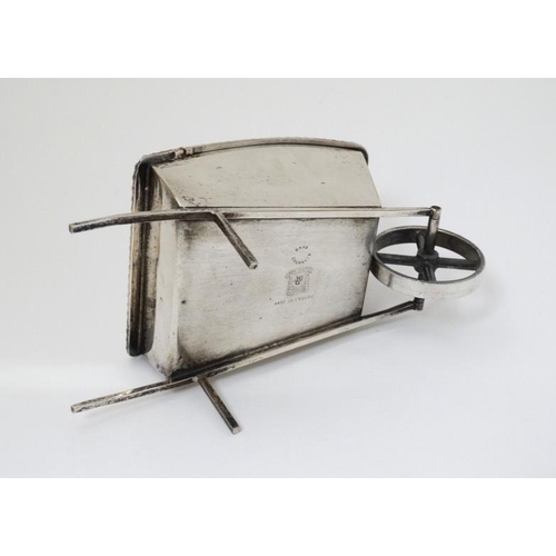 535 - A novelty silver plate sugar box formed as a wheelbarrow with hinged lid 7 1/2'' long