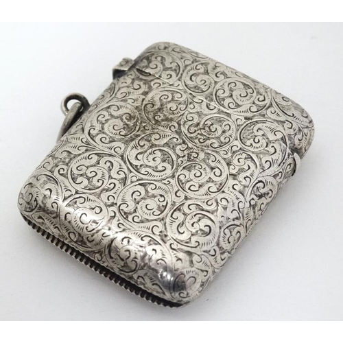 536 - A silver vesta case with engraved decoration with hinged lid and striker under hallmarked Birmingham... 