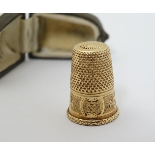 548 - A gilt metal thimble (cased)