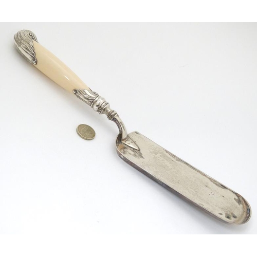 554 - A Victorian silver crumb scoop with silver mounted ivory handle hallmarked Sheffield 1888 maker Harr... 